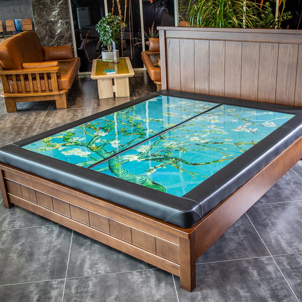 NEXTONE heated bed with a Van Gogh ceramic-printed surface-heating glass top in a premium showroom