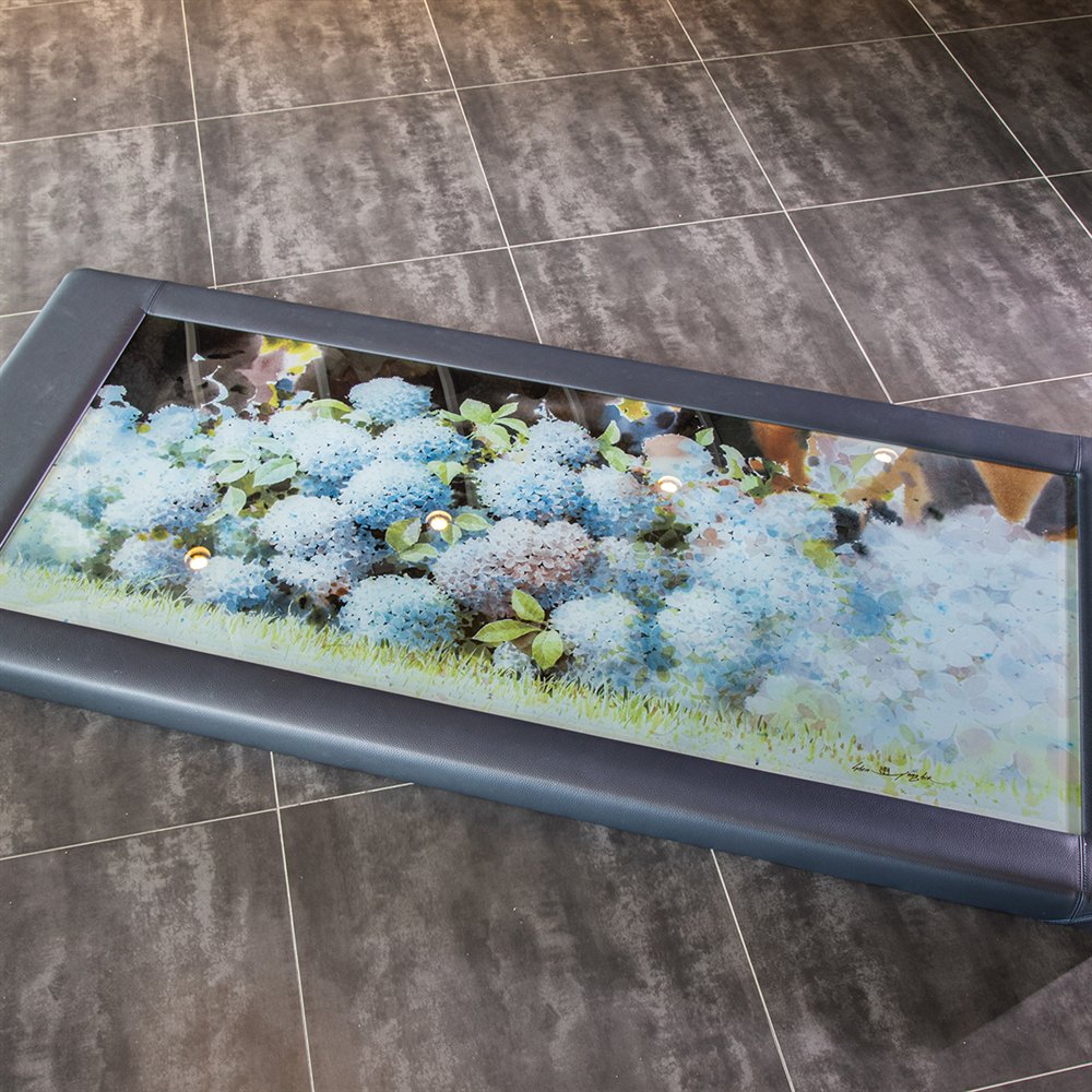 NEXTONE heated art glass table with an illuminated hydrangea ceramic print